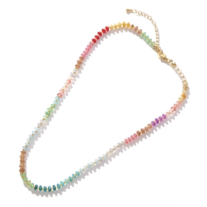 Detail of colorful gradient crystal beaded necklace with golden metal lobster clasp closure