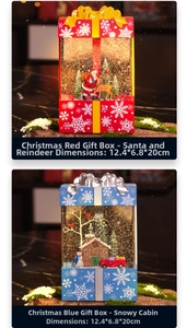 Detail of red and blue Christmas lantern music boxes with Santa and snow scene