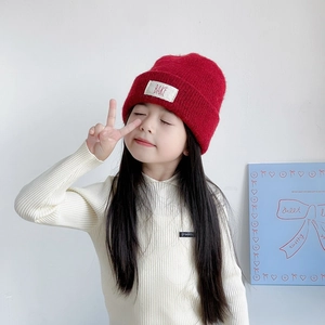 Kids warm red double-layered wool knit beanie with BAKE label for winter comfort