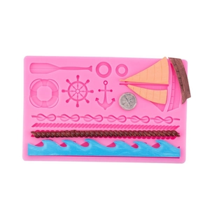 Marine nautical silicone mold featuring oars, anchor, rudder and sailboat for baking