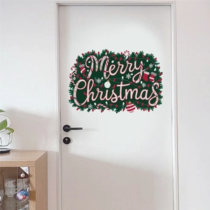Detailed view of Merry Christmas door sticker with holly and candy canes on a white door