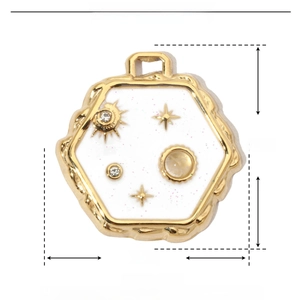 Detail view of hexagonal stainless steel pendant with white enamel and moon star motifs