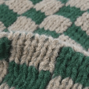 Green and khaki checkerboard knit beanie with thick ribbed texture for winter warmth