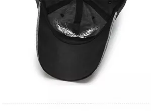 Close-up of internal brim featuring white star and wings embroidery on the baseball cap