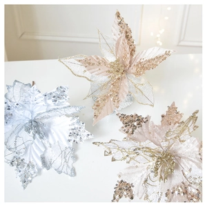Detailed view of champagne and white mesh Christmas flowers with glitter and sequins