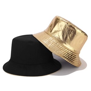 Dual-sided black and metallic gold canvas bucket hats for men and women on white background