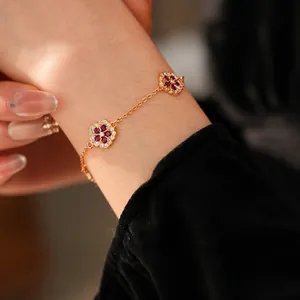 Exquisite 18k gold-plated flower bracelet with sparkling zircon stones on model wrist