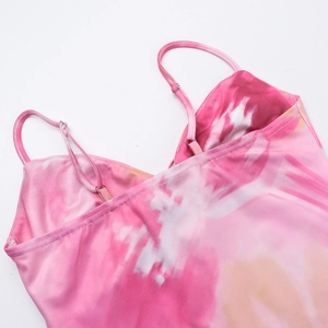 Close-up of pink and orange tie-dye mini dress with adjustable thin shoulder straps