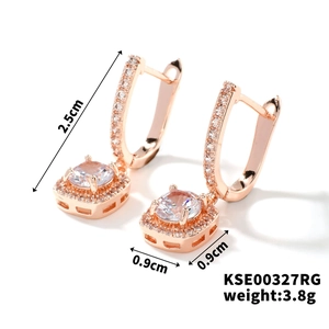Detail view of rose gold earrings featuring cubic zirconia with dimensions 2.5cm by 0.9cm