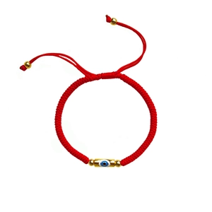 Handmade red cord bracelet with Evil Eye charm and gold beads, adjustable ethnic jewelry