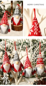 Close-up of LED glowing forest gnome ornaments in red, grey, and white knitted fabric