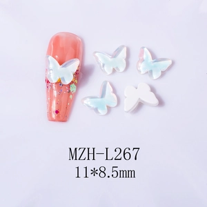 Macro detail of butterfly nail art charms 11x8.5mm with iridescent pearl finish