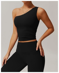 Detail view of black one-shoulder yoga vest with moisture-wicking stretch fabric texture
