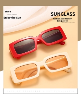 Detail of red and cream square sunglasses with thick frames and inner temple numbering