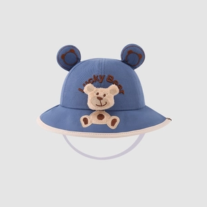 Detail of blue baby bucket hat with bear ears, embroidery and windproof strap