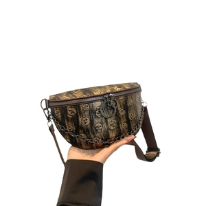 Handheld skull pattern waist bag in brown PU leather with silver chain decoration