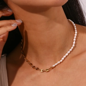 Asymmetric necklace featuring gold coffee bean links and white freshwater pearls for women