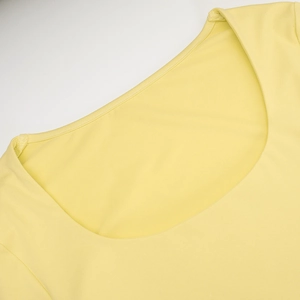 Detail shot of the precise stitching on the square neckline of this yellow casual set