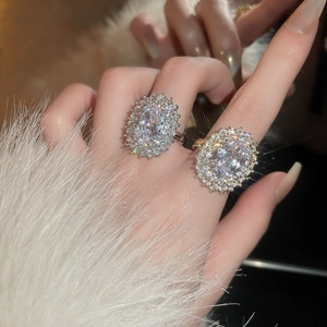 Elegant oval zircon ring with layered vintage style shown on model hand