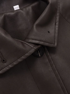 Detailed close-up of dark brown faux leather jacket collar and button placket