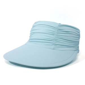 Detail of light blue sun visor hat featuring pleated fabric design and wide brim