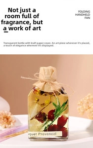 Detail of clear glass diffuser bottle with dried flowers, rustic twine and paper lid