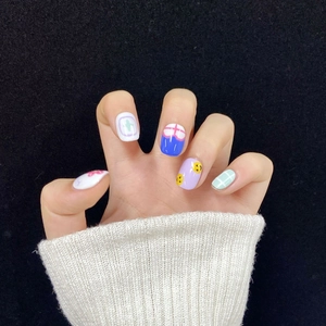 Hand-painted colorful cartoon press-on nails with floral and checkered summer patterns