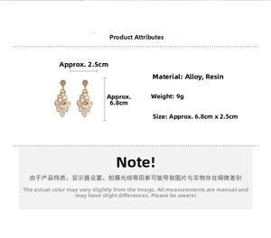 Detail view of gold leaf fringe earrings with cat eye stone, 6.8cm length dimensions