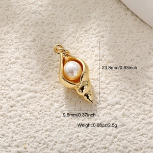 Macro detail of a gold seashell pendant with pearl and precise size measurements