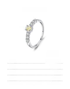 Macro shot of S925 sterling silver ring with square yellow gem and white side stones