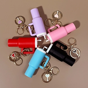 Mini cup keychains with heart charms in purple pink red black and blue silicone finish