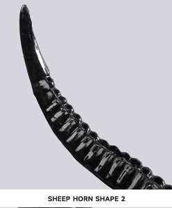 Macro detail of black sheep horn headpiece with spiral texture and polished resin finish