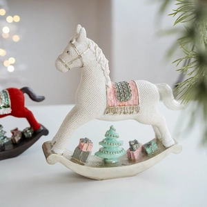 Festive resin rocking horse statue with white texture, pink saddle and green tree decor