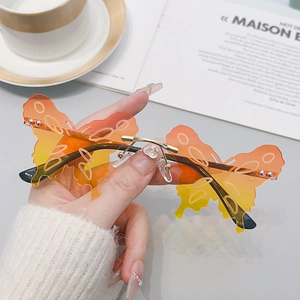 Chic butterfly shaped rimless sunglasses with gradient orange lens and metal frame