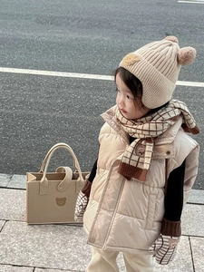 Kids winter set featuring a cream knit scarf and matching accessories on a young model