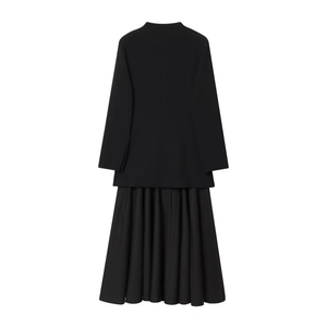 Women's black long sleeve blazer dress with pleated skirt design from the back view