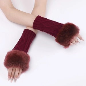 Detail of burgundy cable knit fingerless gloves with luxurious faux fur trim