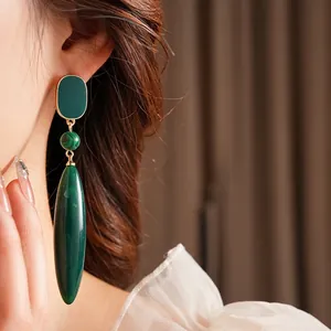Vintage gold drop earrings with peacock green stone beads and malachite pendant