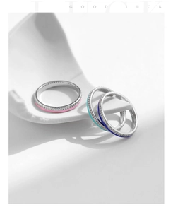 Detailed macro view of S925 sterling silver rings with colorful enamel and pavé zircons