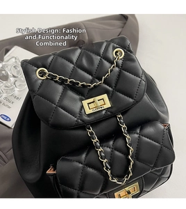 Close-up of quilted leather backpack with gold chain and square turn-lock closure