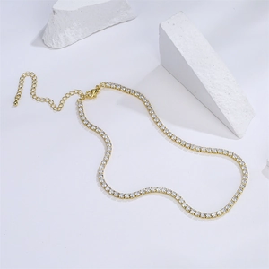 Elegant 18K gold plated necklace with clear cubic zirconia stones on white pedestals