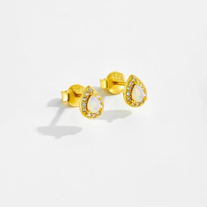 Macro shot of S925 silver gold-plated pear-shaped opal earrings with zircon halo detail