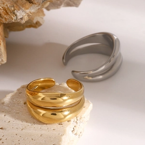 Minimalist double-layer stainless steel open rings in gold and silver finish on white stone