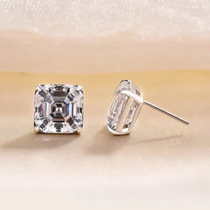 Macro shot of square emerald cut crystal earrings featuring silver four-prong setting