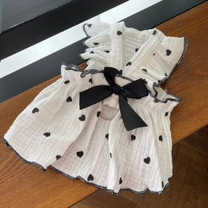 Detail of pet dress with black heart pattern, gauze fabric and metal D-ring buckle
