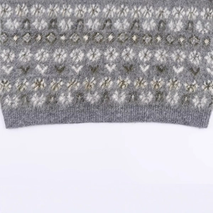 Fashionable Fair Isle jacquard knit sweater with snowflake patterns and ribbed hem