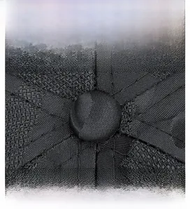 Detailed macro view of the black camouflage baseball cap crown and reinforced stitching
