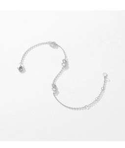 Macro view of S925 sterling silver Mobius bracelet featuring cubic zirconia infinity links