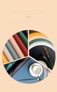 Detail of round faux leather placemats showing textured surface and various color options