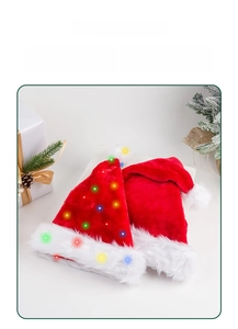 Macro shot of LED Christmas hat with red plush fabric and festive multi-color lights